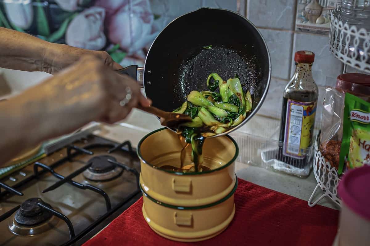 Filling the tiffin with food. Image courtesy of TLOCCTC.