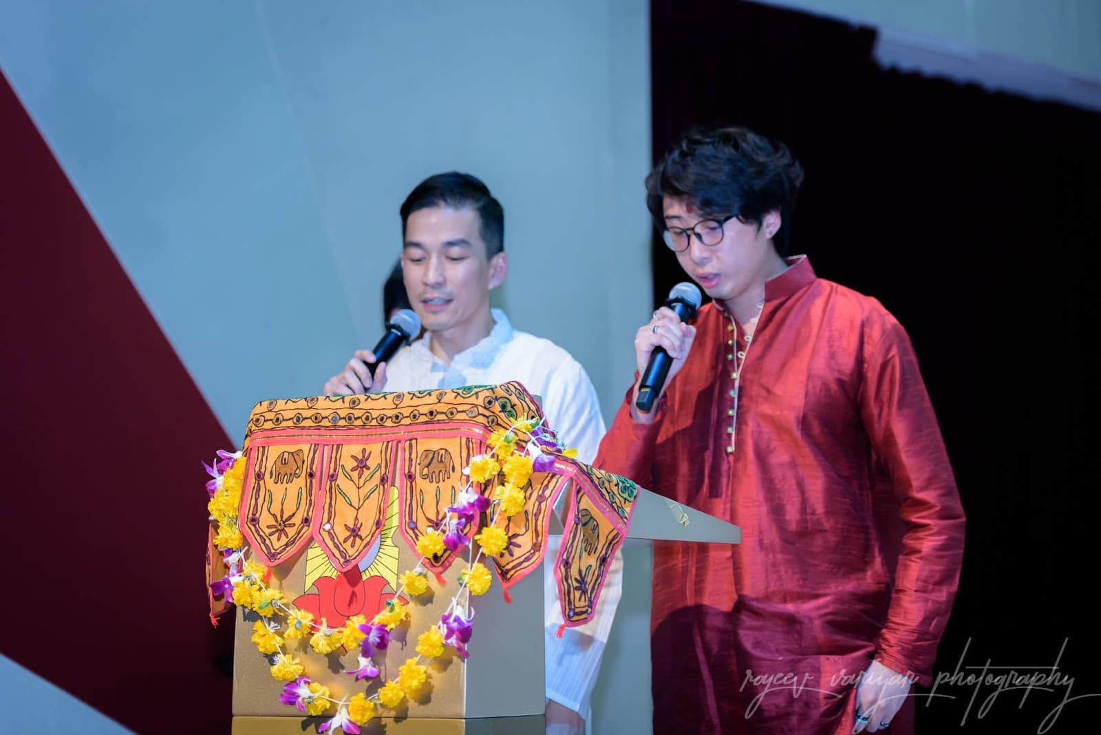 Jireh Koh (right) chanting the Sanskrit poem Bhagavad Gita Dhyanam Shlokam at PGP Hall for the opening of Krishna Manjari in 2019