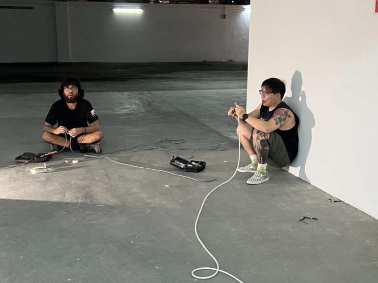 Festival Director John Tung and a friend of Substation wiring new lights in the event space – not something you’d typically see in an art exhibition.