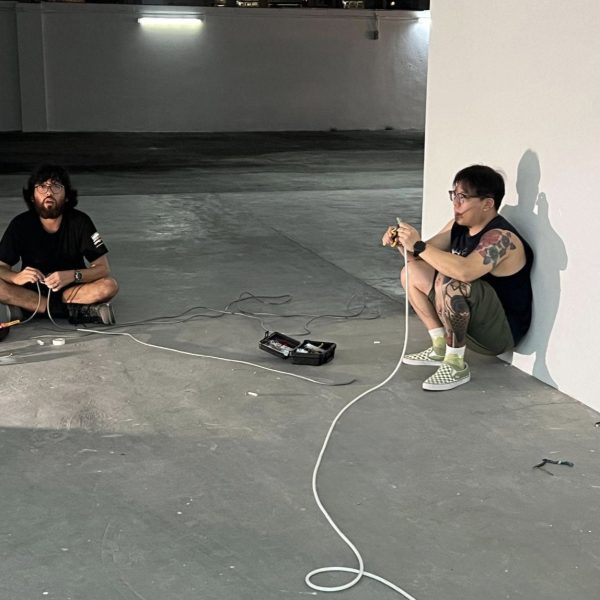 Festival Director John Tung and a friend of Substation wiring new lights in the event space – not something you’d typically see in an art exhibition.